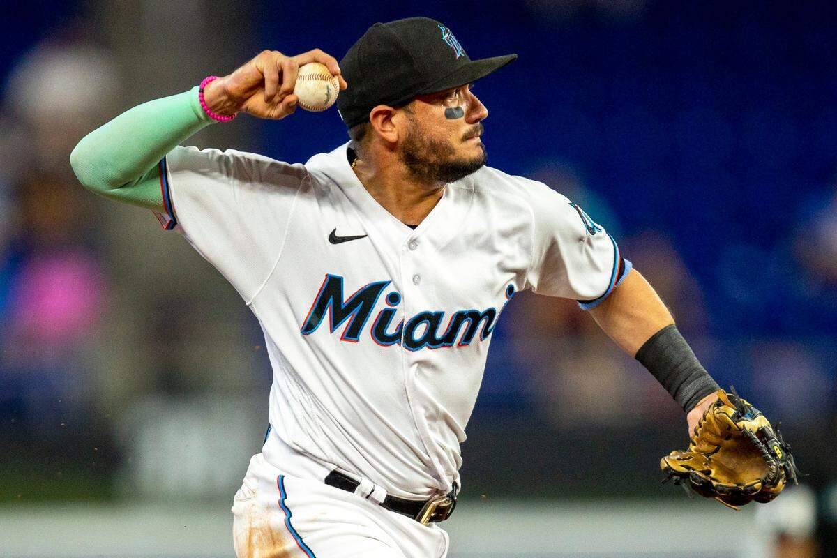 Miami Marlins short stop Miguel Rojas (11) throws the ball to first base during the third inning of an MLB game against the Colorado Rockies at loanDepot park in the Little Havana neighborhood of Miami, Florida, on Thursday, June 23, 2022.