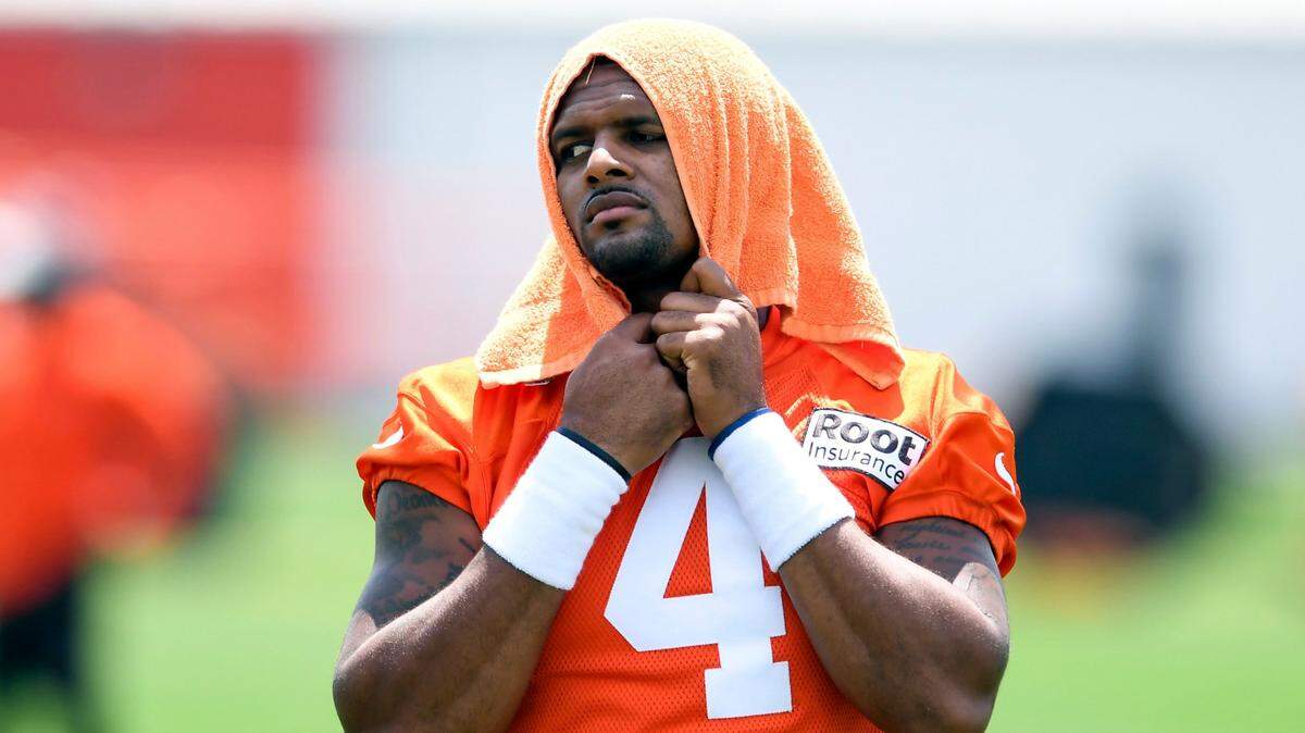 Cleveland Browns quarterback Deshaun Watson looks on during the NFL football team’s training camp, Thursday, July 28, 2022, in Berea, Ohio. Watson was suspended without pay for six games Monday, Aug. 1, 2022, for violating the NFL’s personal conduct policy following accusations of sexual misconduct made against him by two dozen women in Texas, two people familiar with the decision said.