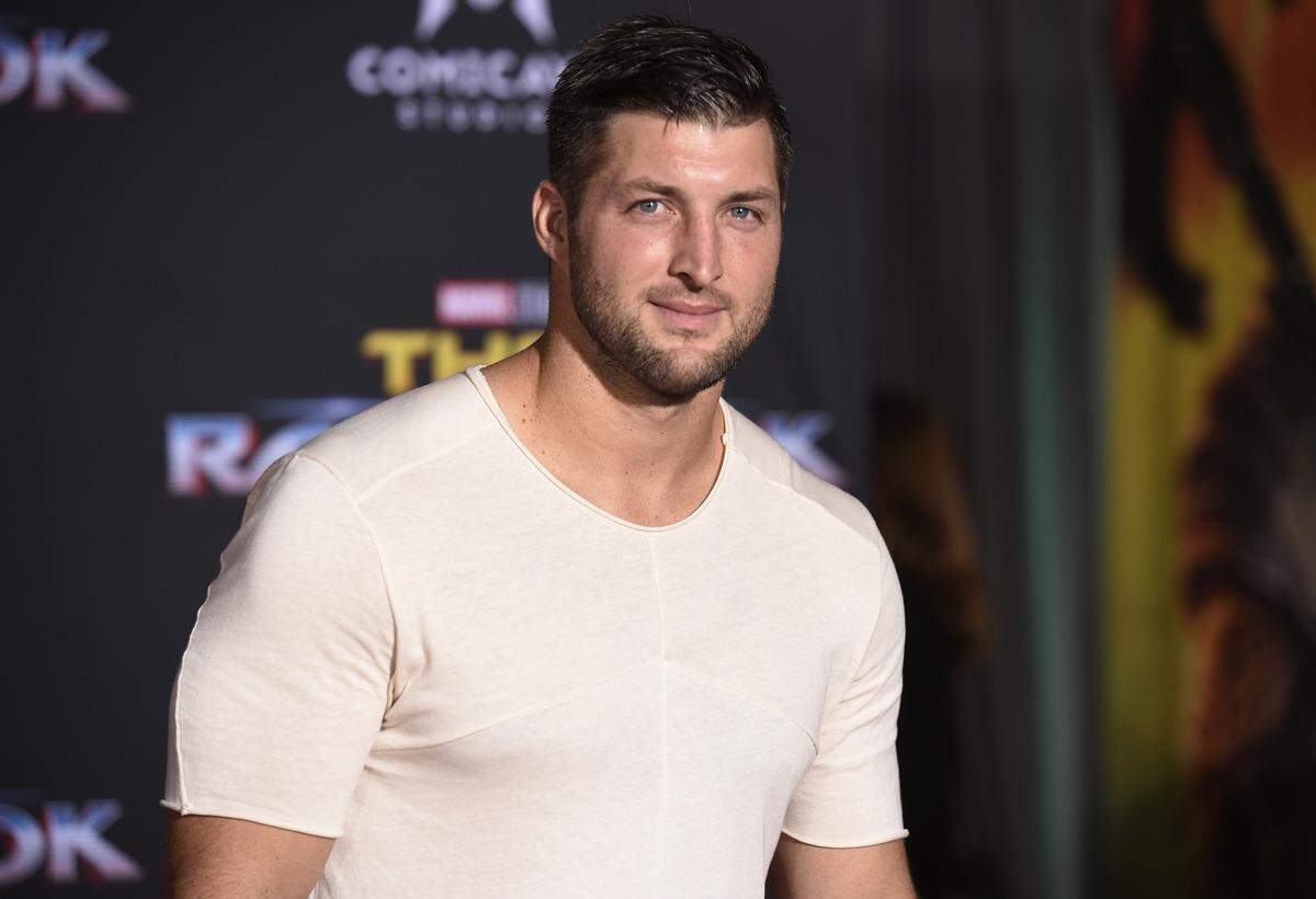 In this Tuesday, Oct. 10, 2017 file photo, Tim Tebow arrives at the world premiere of “Thor: Ragnarok” at the El Capitan Theatre in Los Angeles. Former Denver Broncos and University of Florida quarterback Tim Tebow is engaged. The Heisman Trophy winner announced his engagement on Instagram Thursday, Jan. 10, 2019 to Demi-Leigh Nel-Peters, a South Africa native and the 2017 Miss Universe.