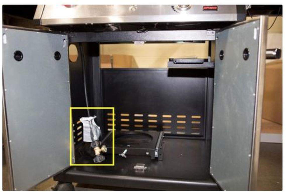 On the recalled grills, the fuel line isn’t attached to the side of the grill and a fuel gauge on regulator assembly.
