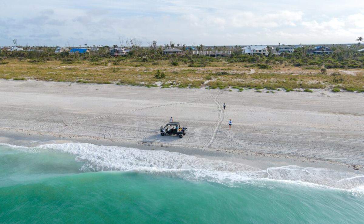 Sanibel-Captiva Conservation Foundation staff locate and document a loggerhead sea turtle journey on Sanibel Island beach during a nesting survey in May 2023.