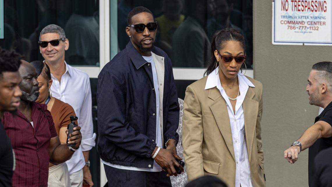 Miami Heat center Bam Adebayo walks out with WNBA center A'ja Wilson during the unveiling ceremony of Heat icon Dwyane Wade’s statue in front of Kaseya Center on October 27, 2024, in Miami.