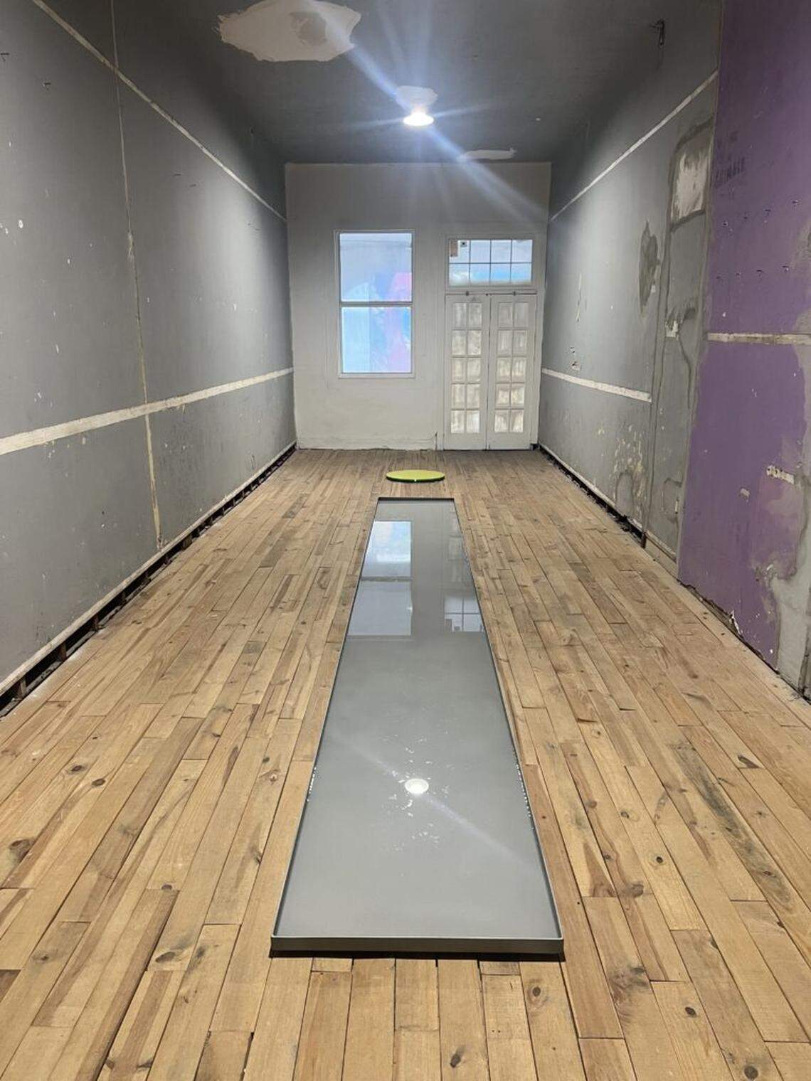 Fared Manzur’s installation at the Rice Hotel are large, shallow, opaque basins filled with water.