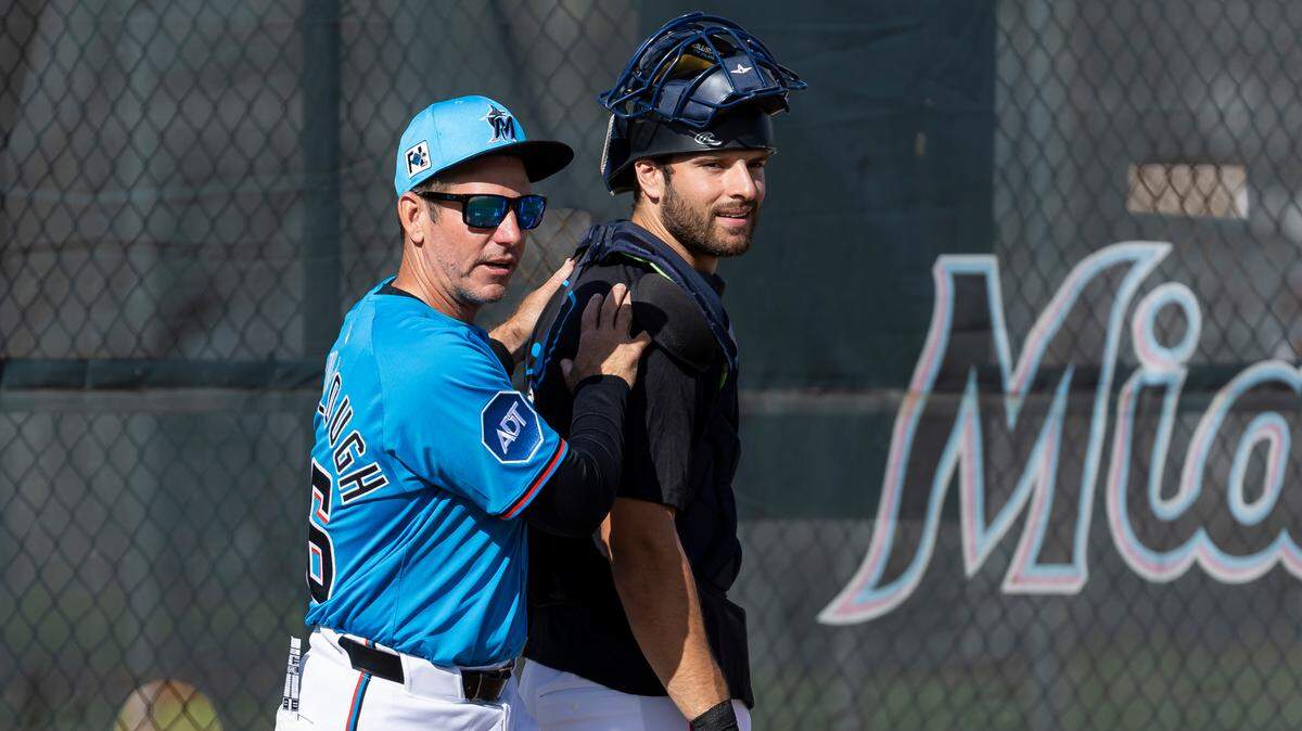 Miami Marlins manager Clayton McCullough (86) talks with catcher Joe Mack (80) during spring training workouts for pitchers and catchers at Roger Dean Chevrolet Stadium on Wednesday, Feb. 12, 2025, in Jupiter, Fla.