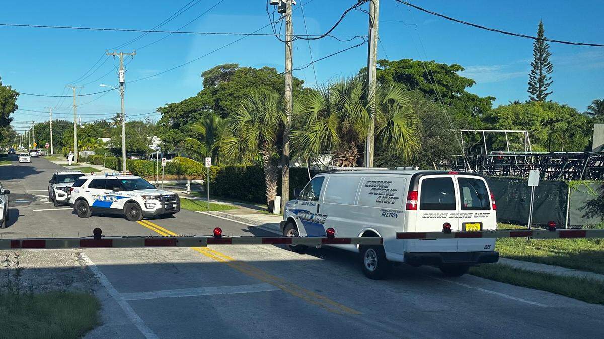 Police cars are parked on train tracks at Southeast Second Avenue and Fourth Street in Delray Beach Friday morning, Sept. 22, 2023. Police say a pedestrian was struck and killed by a train.