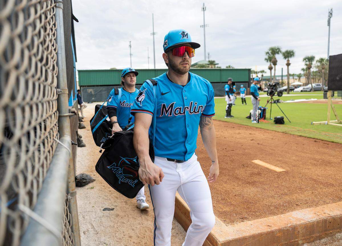 Miami Marlins third base Connor Norby (1) walks toward the field during first full-squad spring training workouts at Roger Dean Chevrolet Stadium on Monday, Feb. 17, 2025, in Jupiter, Fla.
