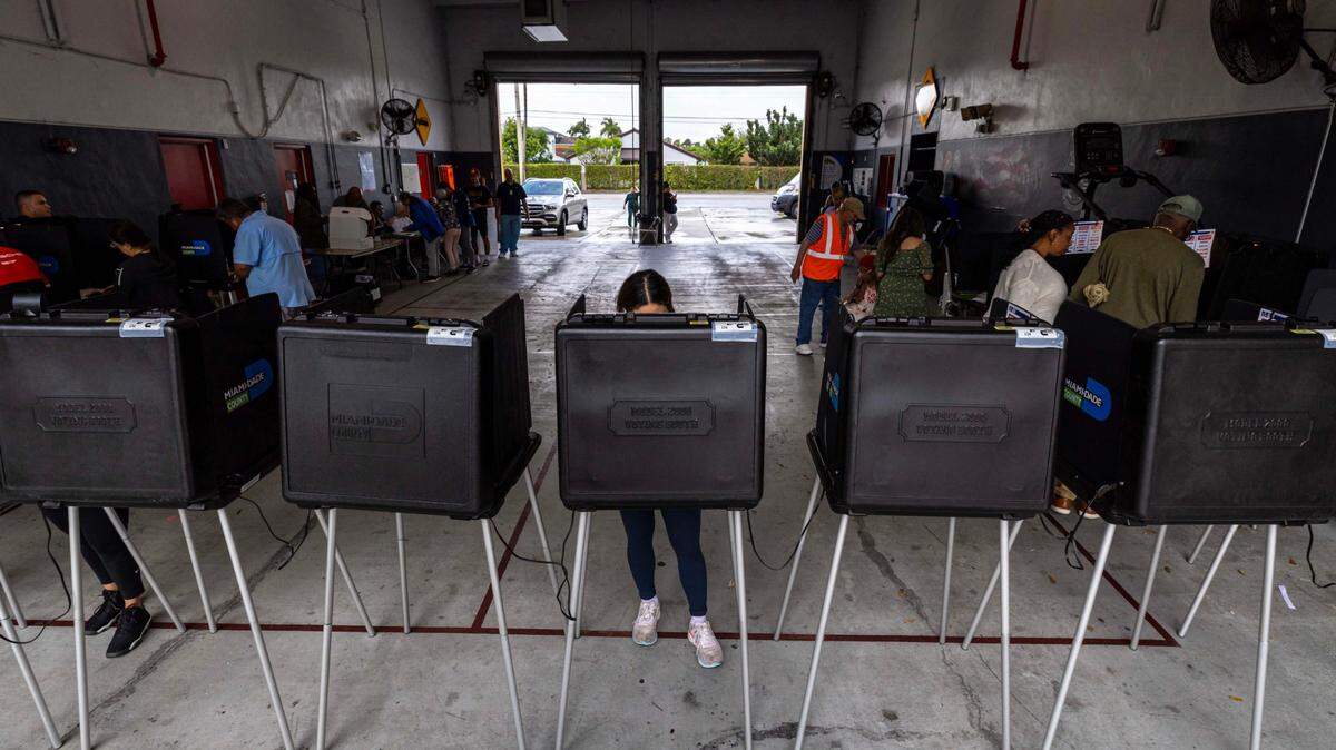 Voters stand at the voting booths on Election Day 2024 at Miami-Dade County Fire Station #56 on Nov. 5, 2024, in Miami.