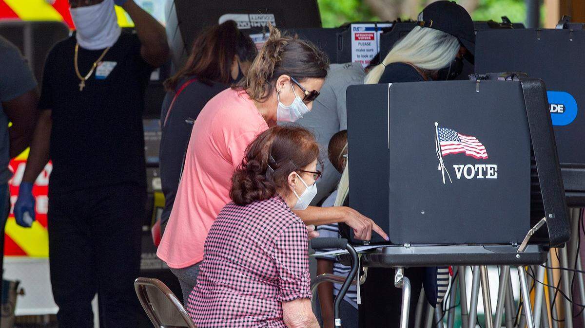 People vote in the early morning on Election Day at the Miami-Dade County East Homestead Fire Rescue Station 65 on November 3, 2020.