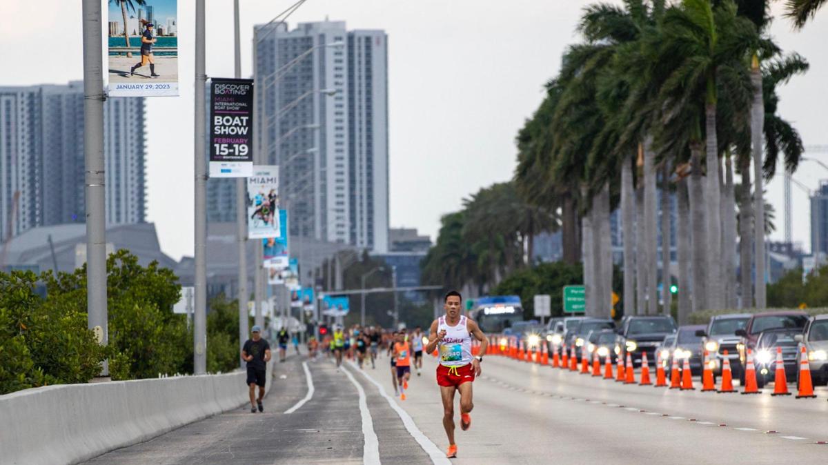 First place finisher Luis Orta, 34, runs along the MacArthur Causeway during the Life Time Tropical 5K in Miami Beach, Florida, on Saturday, January 28, 2023. Orta’s time was 15:25.