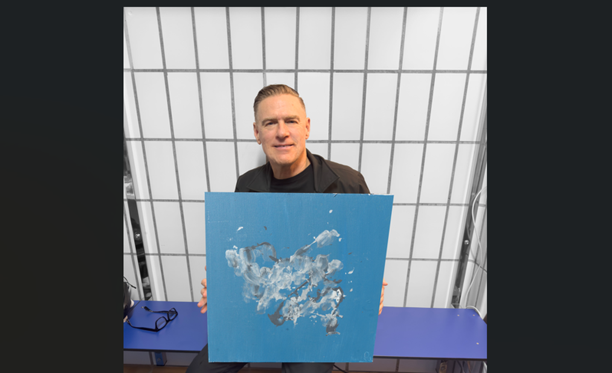 Rock icon Bryan Adams has joined forces with the non-profit organization “Save the Chimps” to exhibit a collaborative art collection of paintings. He is posing with ‘Cloud Number Nine’