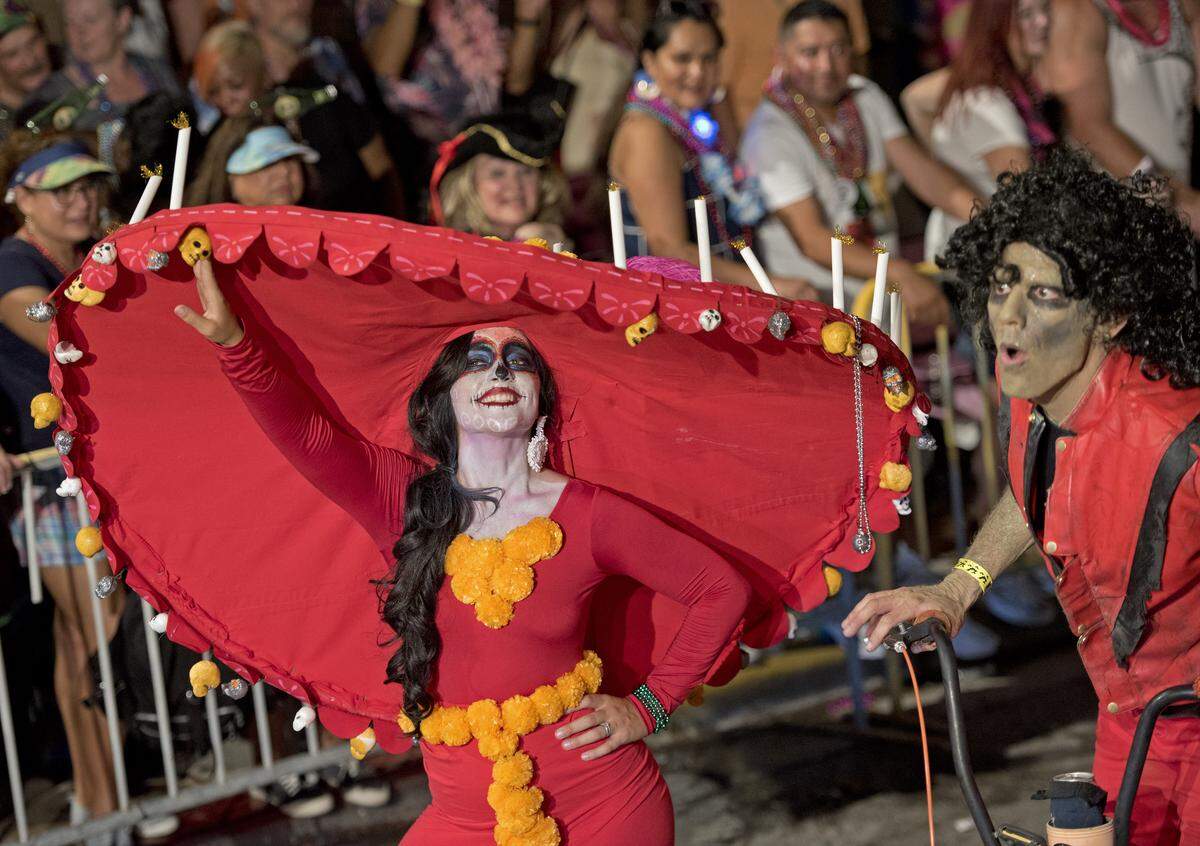 Costumed revelers proceed up Duval Street during the Fantasy Fest Parade Saturday, Oct. 26, 2019, in Key West, Fla. The extravaganza of floats and costumed marching groups was the highlight event of the 10-day Fantasy Fest costuming and masking festival that ends Sunday, Oct. 27. FOR EDITORIAL USE ONLY (Florida Keys News Bureau)