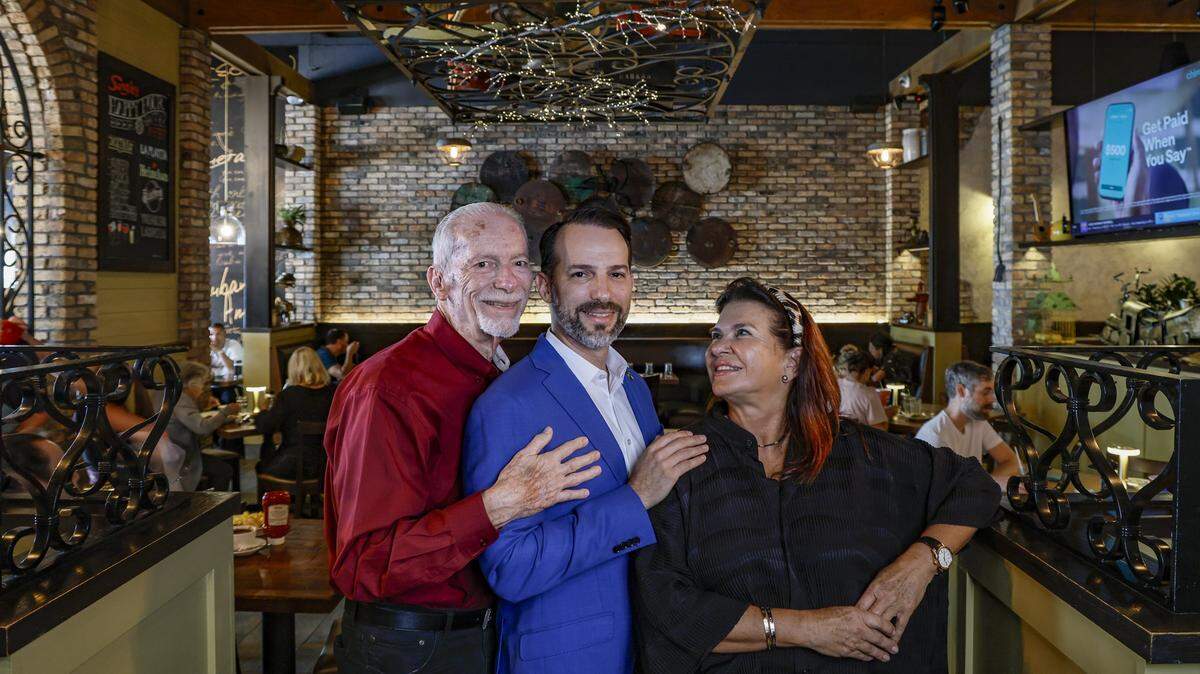 CEO of Sergio's Family Restaurants, Carlos Gazitua, at center, with his father John Gazitua, and mother Blanca Cabrera, at Sergio's in Kendall, as the local restaurant chain celebrates it's 50th Anniversary in Miami, Florida, on Wednesday, September 24, 2025.