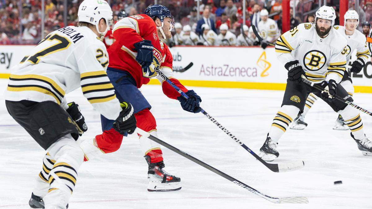 Florida Panthers left wing Matthew Tkachuk (19) takes a shot toward goal as Boston Bruins left wing Pat Maroon (61) looks on in the second period of Game 1 of the second-round series of the Stanley Cup Playoffs on Monday, May 6, 2024, in Sunrise, Fla.