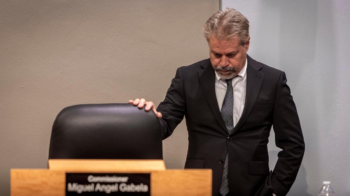 Miami City Commissioner Miguel Angel Gabela stands next to his seat before the start of the first Miami City Commission meeting of the year.