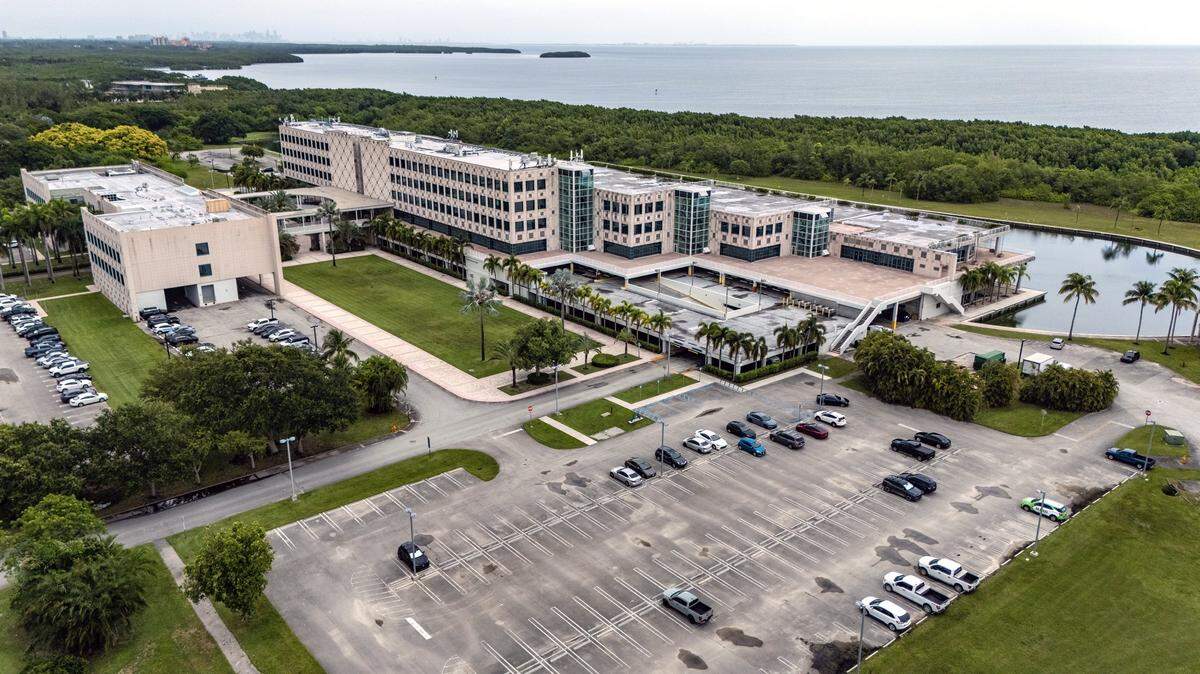 A drone’s-eye view shows the Palmetto Bay Village Center office campus on a flood-prone site on Biscayne Bay on July 2, 2025. The owners plan to expand the complex, built by Burger King as its corporate headquarters in the 1980s, into village of apartments, townhomes, retail, restaurants, offices and a hotel.