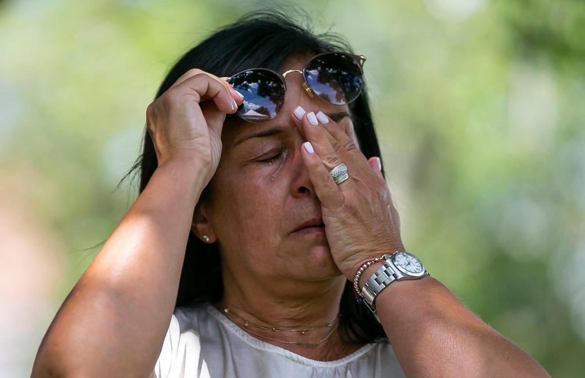 Andrea Langesfeld wipes away tears as she participates in a ceremony for her late daughter, Nicole “Nicky” Langesfeld, on Wednesday, June 22, 2022 in Doral, Florida.