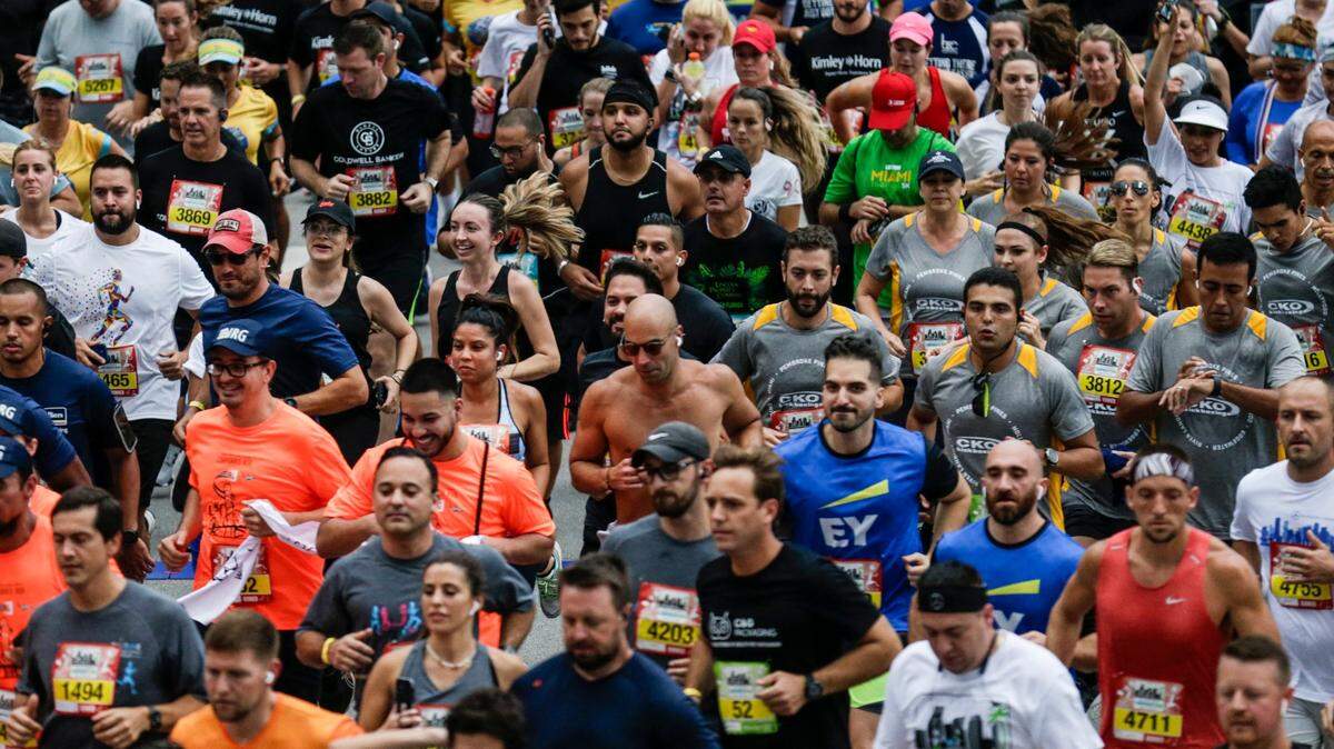 Runners participate in the 5K (3.1 mile) run/walk 2021 Mercedes Corporate Run in downtown Miami, Florida on Thursday, September 23, 2021.