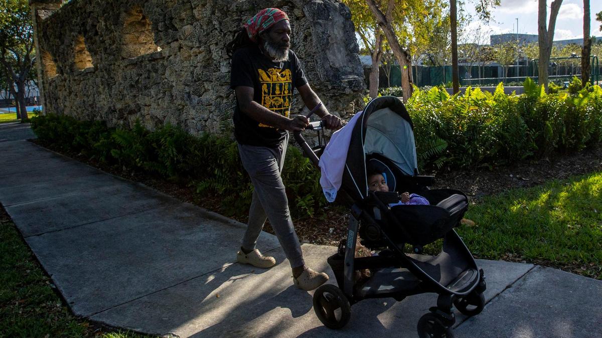 North Miami Beach has a population comprised of about 42% Black, 39% Hispanic, 17% white and 3% Asian. The city has the cheapest median monthly home rents in Miami-Dade County. Above: Daniel Andre, 62, walks with his granddaughter, 8-month-old Gisselle, during a stroll at Victory Park near his home in North Miami Beach.