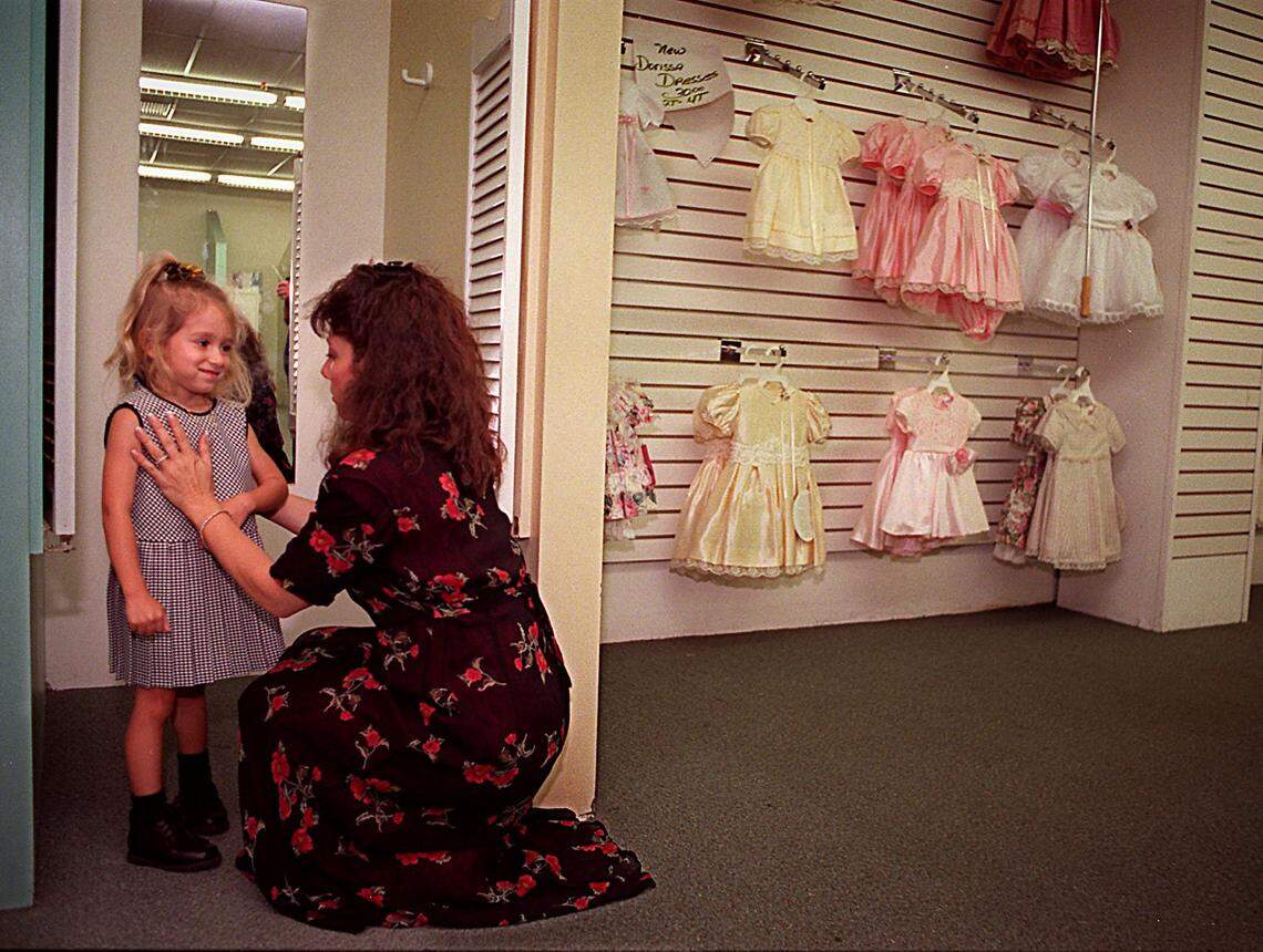 In 1996, Fort Lauderdale mom Debbie Gober at Dorissa Children’s World in the Miami Fashion District, helping her 4-year-old daughter, Chelsea.