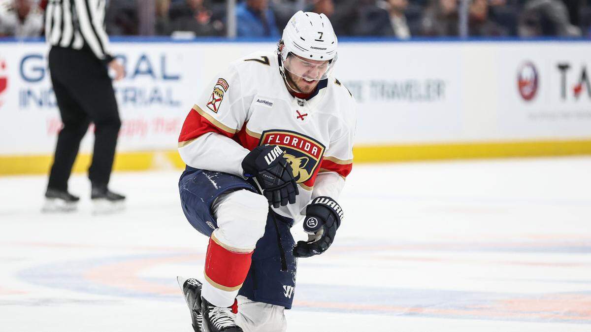 Mar 16, 2025; Elmont, New York, USA; Florida Panthers defenseman Dmitry Kulikov (7) gets up off the ice following a collision in the first period against the New York Islanders at UBS Arena.