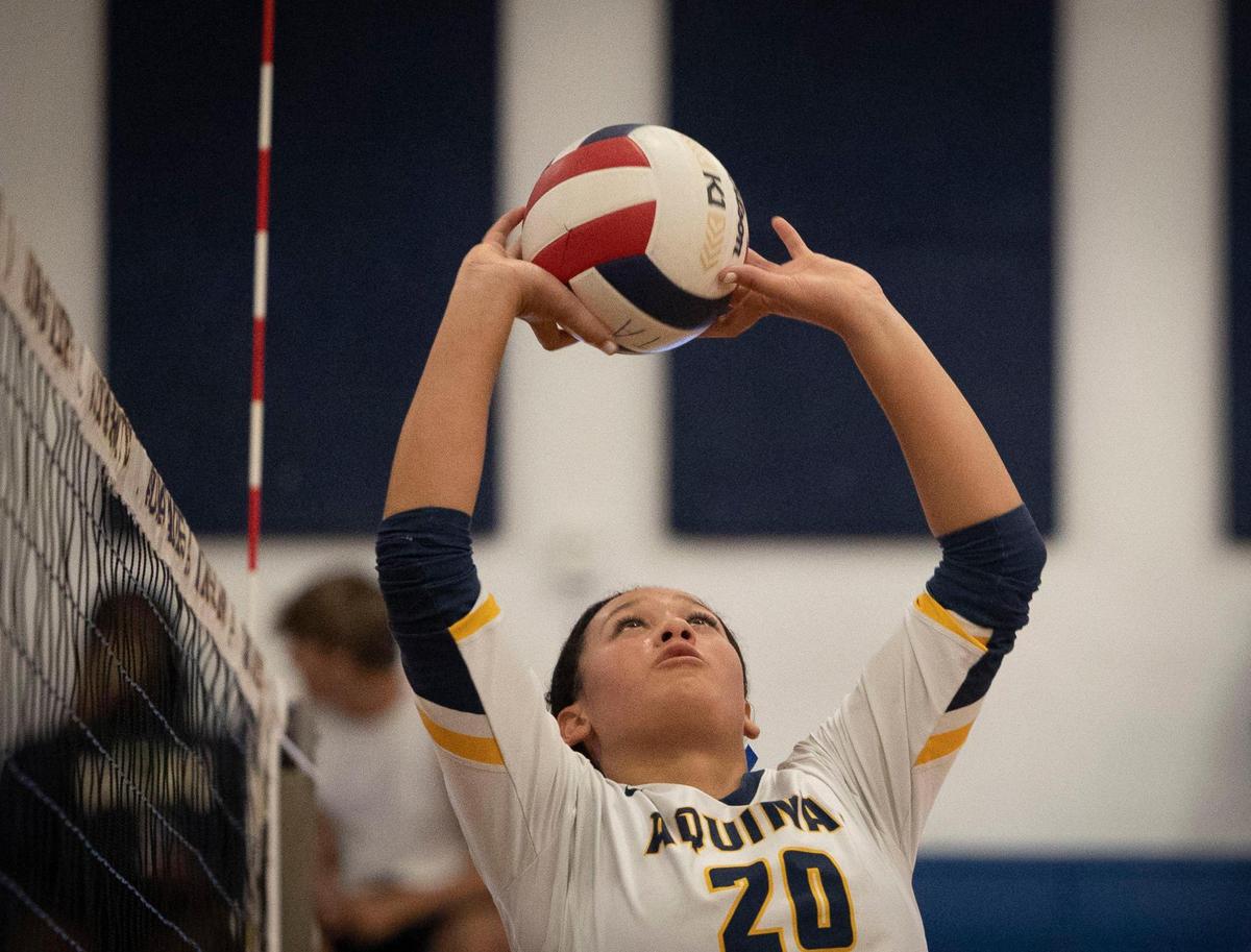 St. Thomas Aquinas Raiders Mikayla Porter (20) sets the ball during the regional volleyball championship against Lourdes Academy on Wednesday, Nov. 1, 2023, at St. Thomas Aquinas School in Fort Lauderdale.