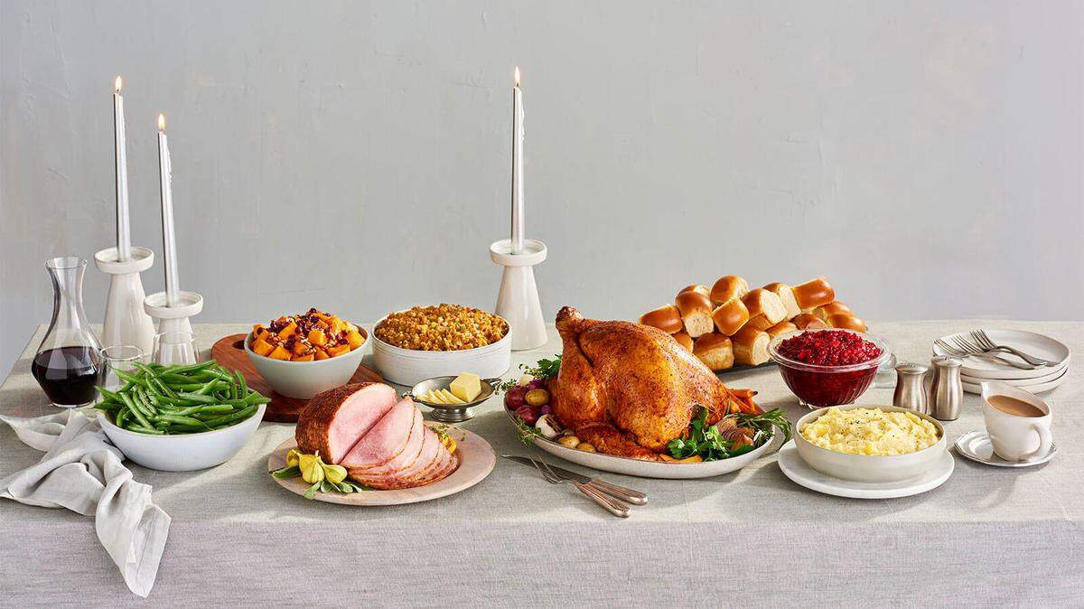 A table loaded with traditional Thanksgiving food.