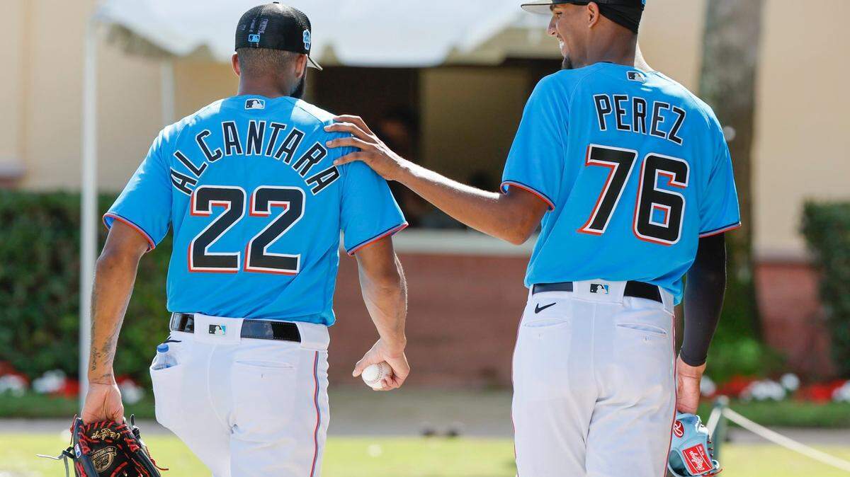 Miami Marlins pitchers Sandy Alcantara (left) and Eury Perez (right) talk on their way to the clubhouse after a workout at Roger Dean Chevrolet Stadium in Jupiter, Florida on Thursday, February 16, 2023.