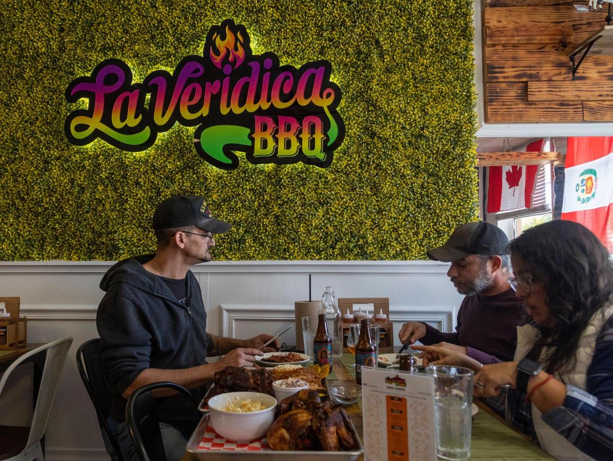 Customers enjoy lunch inside La Veridica BBQ in Hialeah.