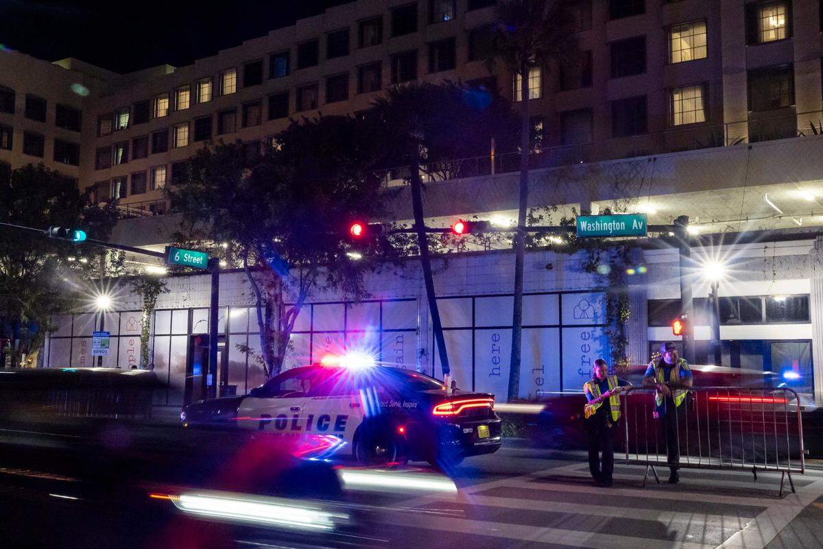 Police officers patrol traffic down Washington Avenue and 6th Street during spring break on Friday, March 14, 2025, in Miami Beach, Fla.