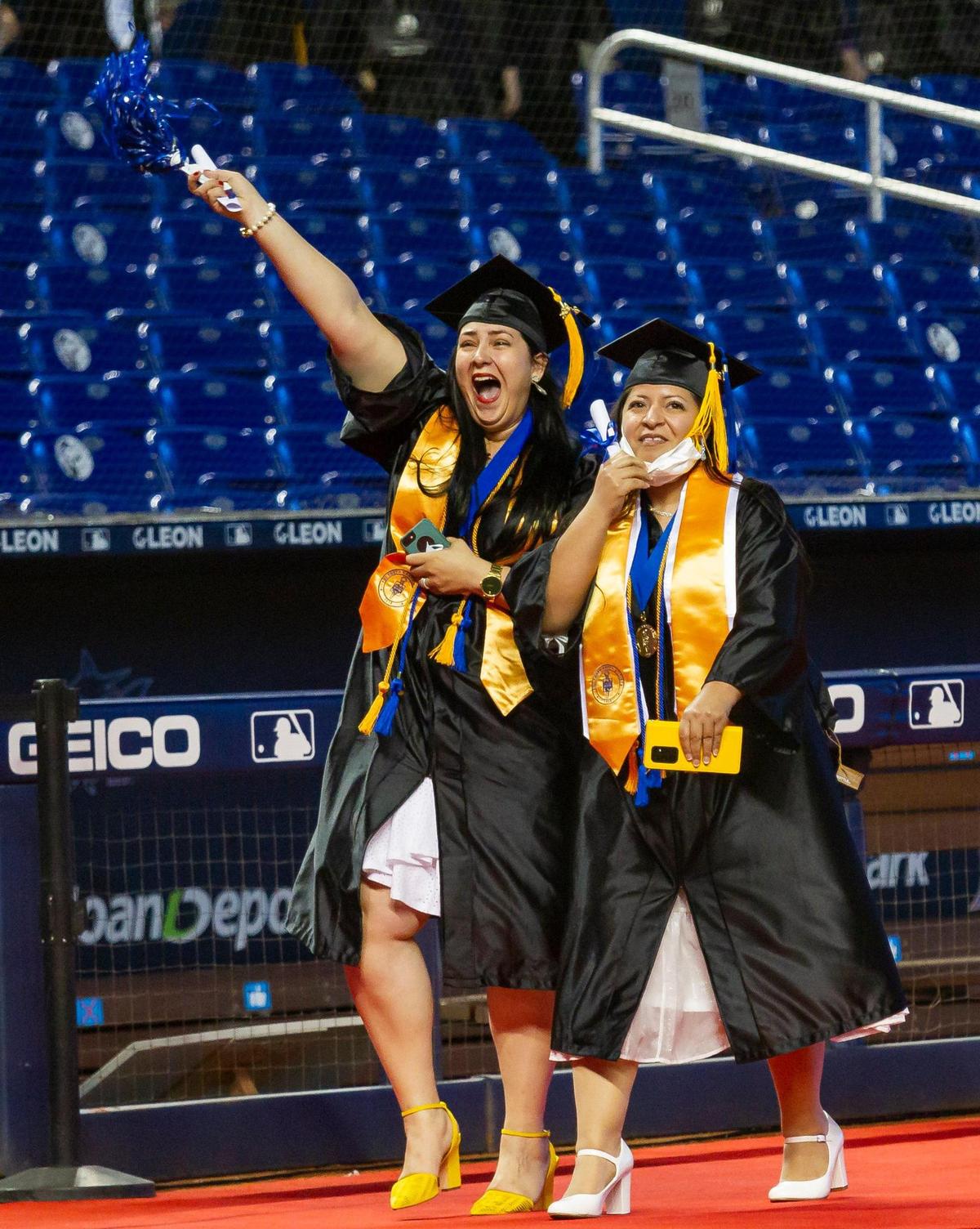Miami Dade College students react during their graduation ceremony inside loanDepot park in Miami, Florida on Saturday, May 1, 2021.