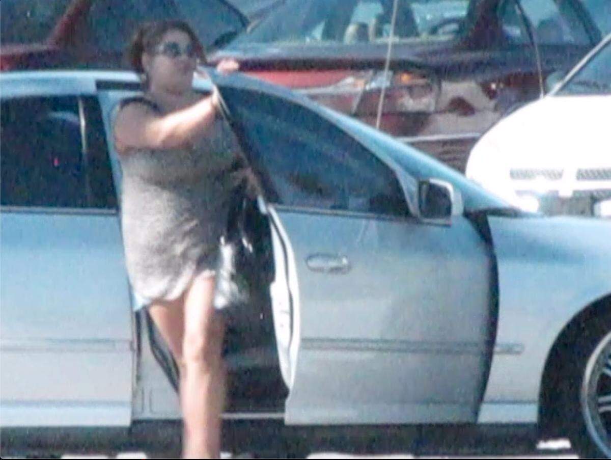December 7, 2011, surveillance video screen grab of Jomari DeLeon leaving the car of an undercover officer after selling her prescription pills.