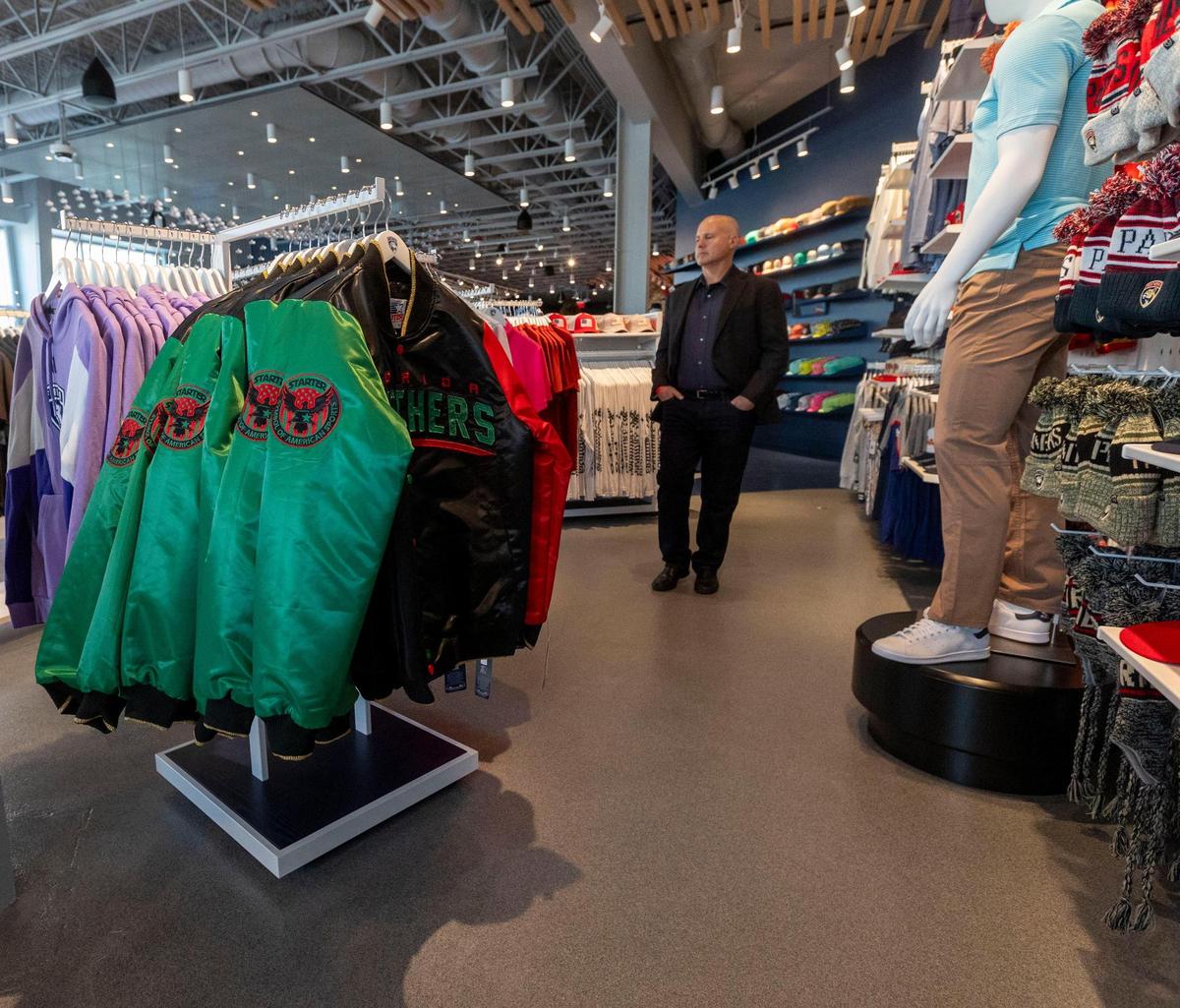 A man looks at Panthers merchandise at the store located in the newly constructed Baptist Health IcePlex in Fort Lauderdale.