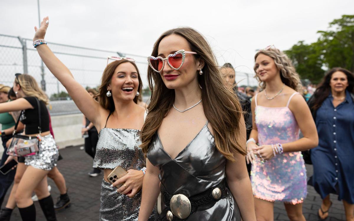 Taylor Swift fans react as they arrive to Hard Rock Stadium to watch Taylor Swift’s The Eras Tour on Friday, Oct.18, 2024, in Miami Gardens, Fla.