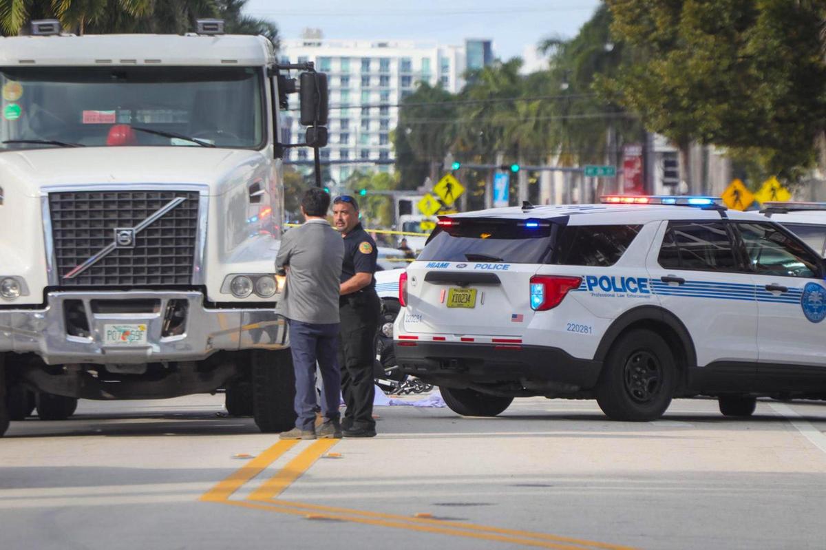 A woman pushing a baby in a stroller across Biscayne Boulevard was killed after being pinned under a dump truck on Feb. 14, 2024, Miami police said.
