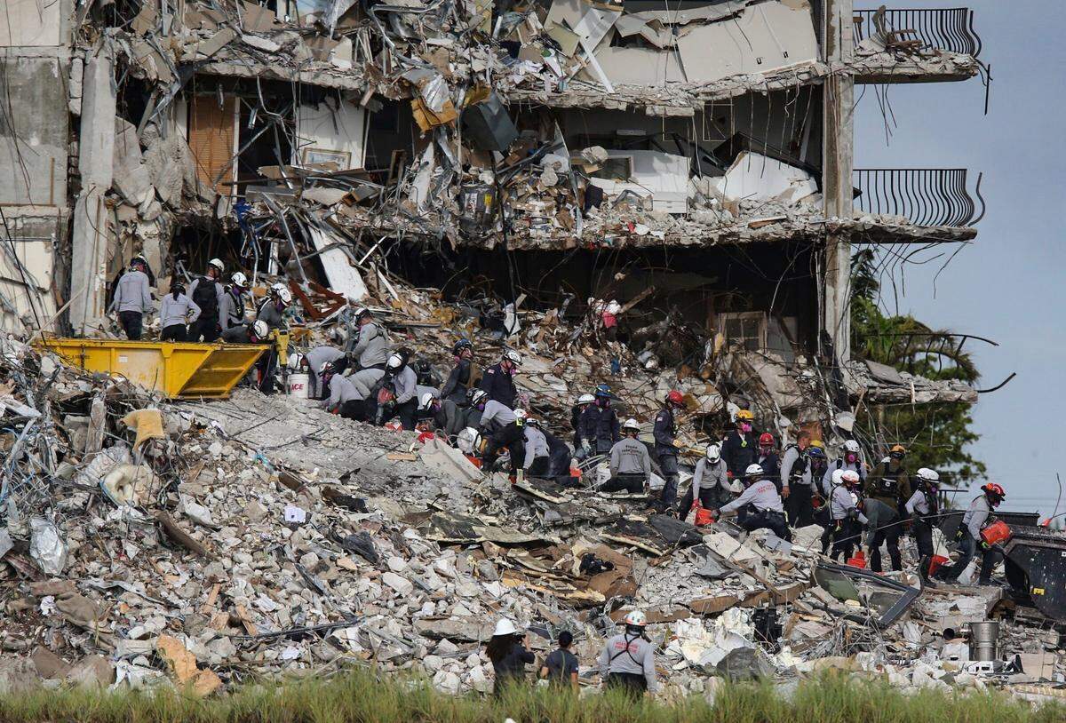 Search-and-rescue teams look for survivors at the Champlain Towers South condo on June 29, 2021, in Surfside. The condo tower partially collapsed on June 24, 2021, killing 98 people.