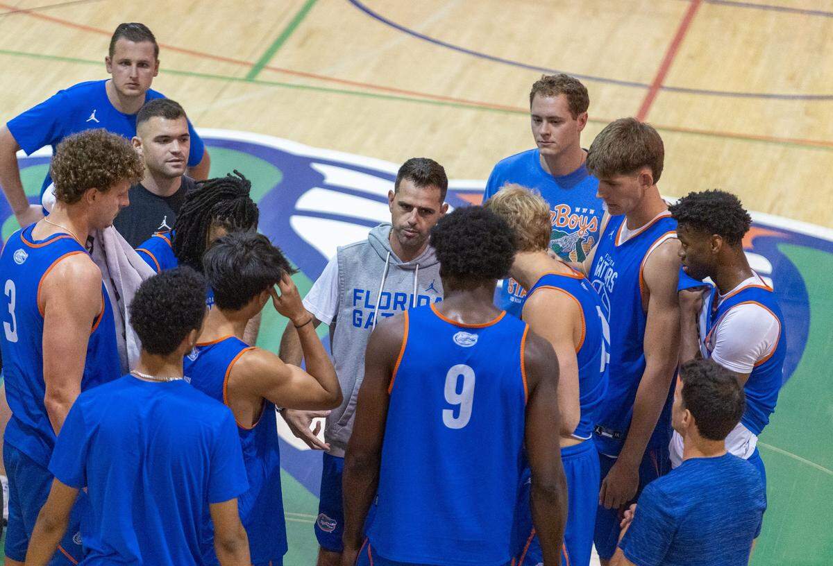Florida head coach Todd Golden, center, gets the program started during afternoon basketball practice at the Florida Basketball Practice Facility in Gainesville, FL on Tuesday, September 30, 2025. [Alan Youngblood/Gainesville Sun]
