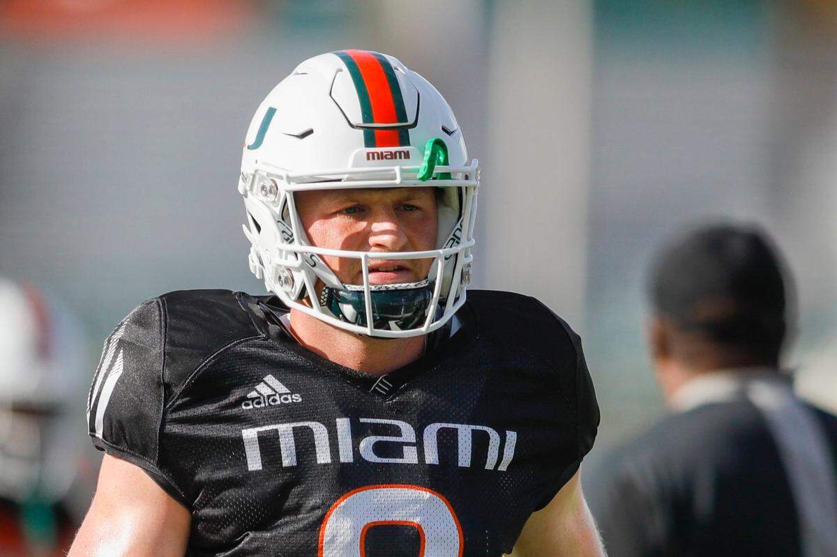 Miami Hurricanes quarterback Tyler Van Dyke (9) runs on the field during football practice at the University of Miami campus in Coral Gables, Florida, Tuesday, August 30, 2022.