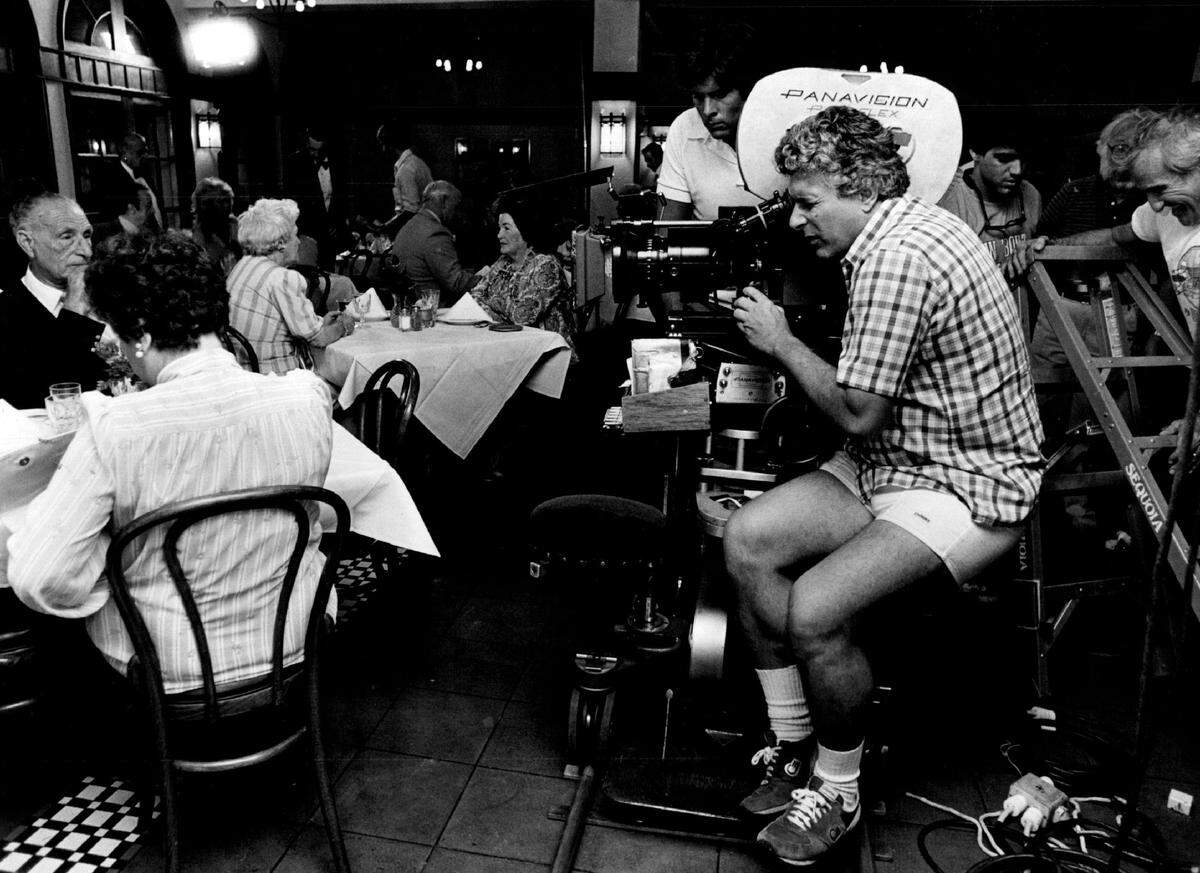 Crews film a scene from the 1985 movie “The Mean Season” at Joe’s Stone Crab.