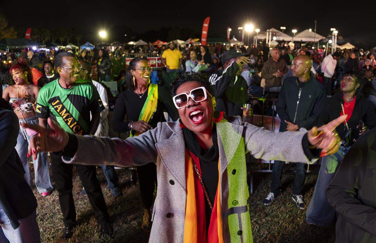 Dona-Lee Raymond dances during the Reggae Genealogy music festival at Volunteer Park .