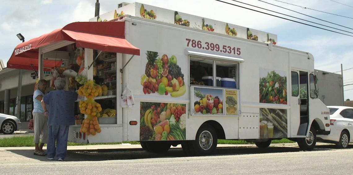 A bodega truck sits outside a shopping plaza where people can shop for produce and other cooking essentials in Miami, FL, on Wednesday, June 20, 2018.