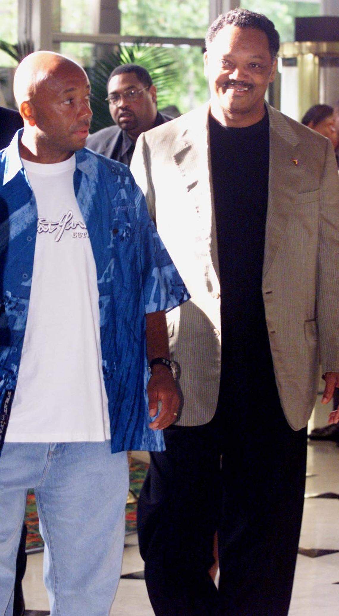 In 2001 at the Fontainebleau hotel in Miami Beach, Founder and CEO of Def Jam Records Russell Simmons, left, and the Rev. Jesse Jackson arrive together at the The Source Image Awards.