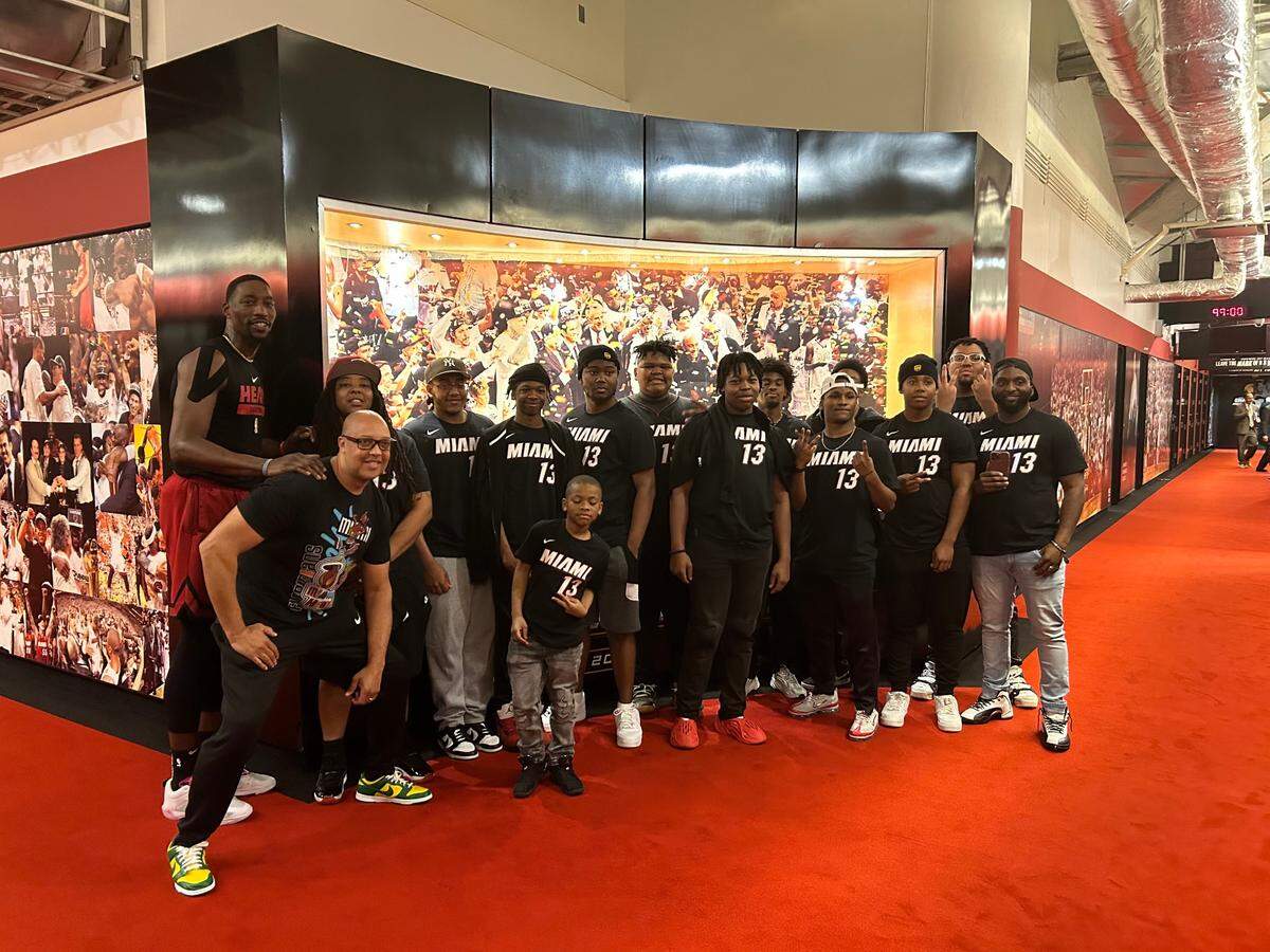 Miami Heat center Bam Adebayo (far left) held a meet and greet with high school students from Greensboro, North Carolina, on Wednesday, December 28, 2022, as part of a holiday trip to Miami that he arranged for them through his foundation.