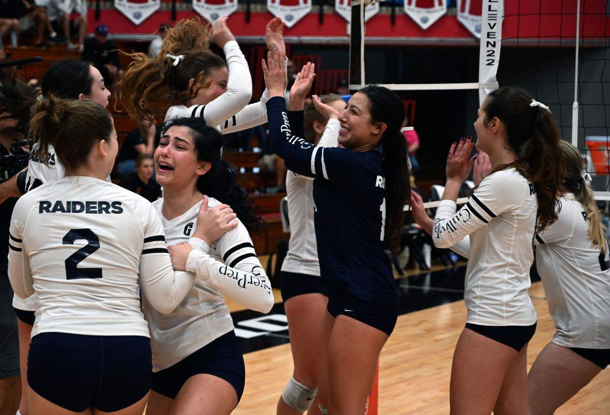 Gulliver Prep players hug and celebrate after winning the Class 3A girls volleyball state championship Saturday at the FHSAA Finals at Polk State College in Winter Haven.