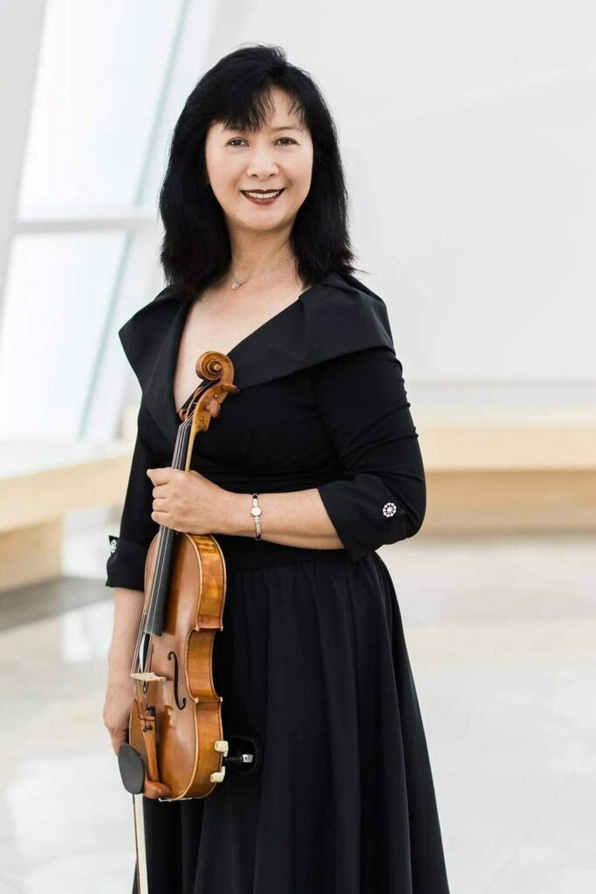 Concertmaster and violinist Mei Mei Luo steps into the solo spotlight on violin for Pablo Sarasate’s “Fantasy on Carmen” during the Miami City Ballet orchestra’s upcoming performance, “Ballet Classics Under the Stars,” at the Sanctuary of the Arts.