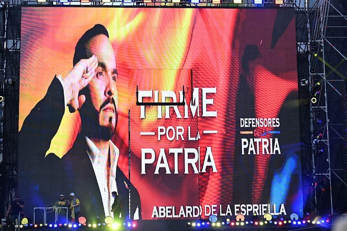 Supporters of presidential candidate Abelardo de la Espriella of the Defensores de la Patria movement watch a giant screen showing a portrait of the candidate and the slogan "Firm for the fatherland" following the runoff election in Barranquilla, Colombia, on June 21, 2026. A flamboyant US-backed lawyer who has never held public office narrowly won Colombia's presidential runoff on June 21, swinging the country hard to the right on a promise to wage war against drug-running guerrilla groups. With more than 99 percent of polling centers reporting, Abelardo de la Espriella had 49.67 percent of the vote, an unassailable lead over his rival, left-wing Senator Ivan Cepeda who trailed at 48.69 percent, according to official results. (Photo by Juan BARRETO / AFP via Getty Images)