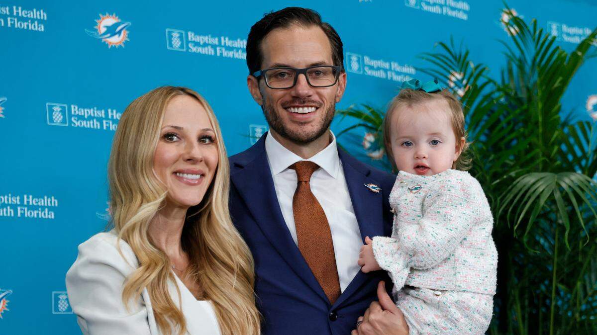 New Miami Dolphins head coach Mike McDaniel poses for the pictures alongside his wife Katie and daughter Ayla June after his introductory press conference at Baptist Health Training Complex in Hard Rock Stadium on Thursday, February 10, 2022 in Miami Gardens, Florida.