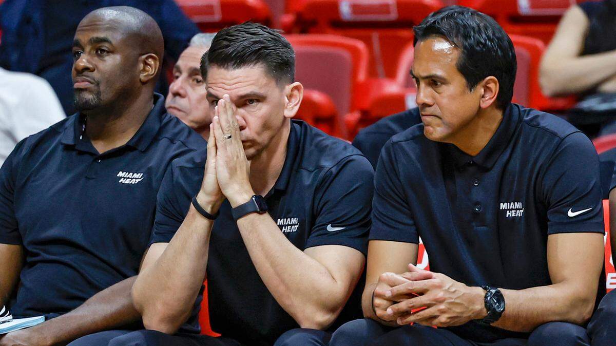 Miami Heat head trainer Wes Brown, assistant coach Chris Quinn and head coach Erik Spoelstra, left to right, react as the Heat trails late in the fourth quarter against the Brooklyn Nets at Miami-Dade Arena in Miami on Saturday, March 25, 2023.
