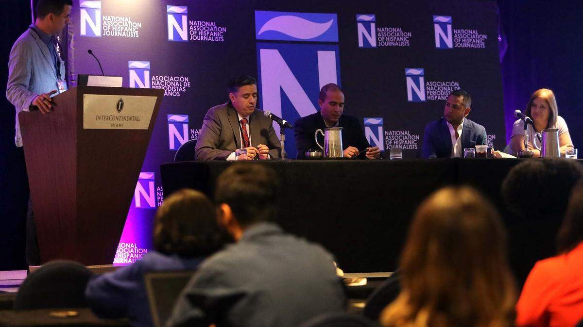 In this file photo, members of the press — including USA Today, CNN, WPLG and the Miami Herald — take part in a panel discussion during a journalism conference in Miami.
