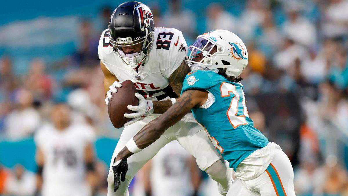 Miami Dolphins cornerback Cam Smith (24) tackles Atlanta Falcons wide receiver J.J. Arcega-Whiteside (83) on a reception in the first half during a preseason game in the fourth quarter at Hard Rock Stadium in Miami Gardens on Friday, August 11, 2023.
