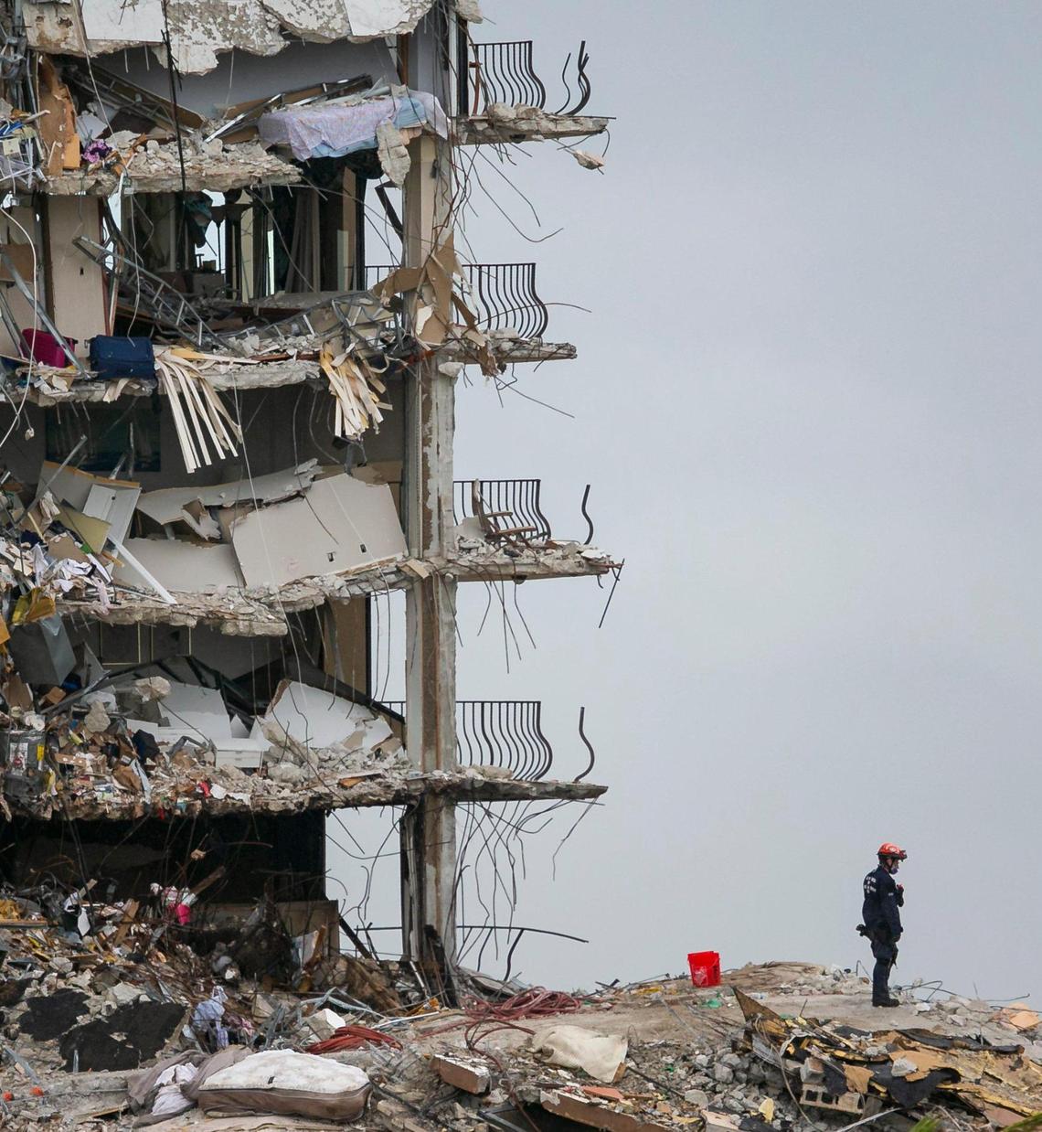 Search-and-rescue teams comb through rubble at the partially collapsed Champlain Towers South condo building in Surfside on June 28, 2021.